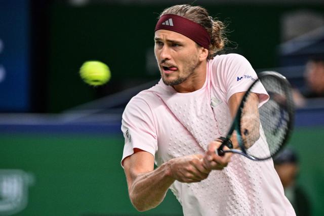 Germany's Alexander Zverev hits a return to Australia's Alex de Minaur during their men's singles quarter-final match at the Shanghai Masters tennis tournament in Shanghai on October 15, 2026. (Photo by Hector RETAMAL / AFP)