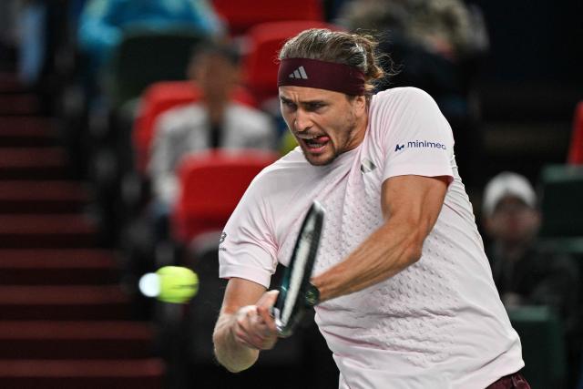 Germany's Alexander Zverev hits a return to Australia's Alex de Minaur during their men's singles quarter-final match at the Shanghai Masters tennis tournament in Shanghai on October 15, 2026. (Photo by Hector RETAMAL / AFP)