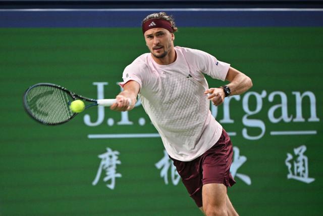 Germany's Alexander Zverev hits a return to Australia's Alex de Minaur during their men's singles quarter-final match at the Shanghai Masters tennis tournament in Shanghai on October 15, 2026. (Photo by Hector RETAMAL / AFP)