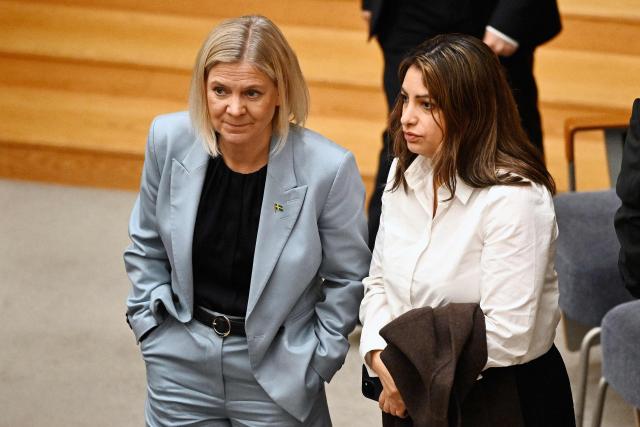 Social Democratic party leader Magdalena Andersson (L) speaks with Left Party leader Nooshi Dadgostar during a session of the Swedish Parliament Riksdagen on Ocotber 15, 2026 in Stockholm, as they meet to vote for a prime minister after the general elections. Sweden's lawmakers on Ocotber 15, 2026 voted overwhelmingly against Social Democratic party leader Magdalena Andersson as new prime minister, as was widely expected amid a deadlock to form a government following September elections. (Photo by Fredrik SANDBERG / various sources / AFP) / Sweden OUT