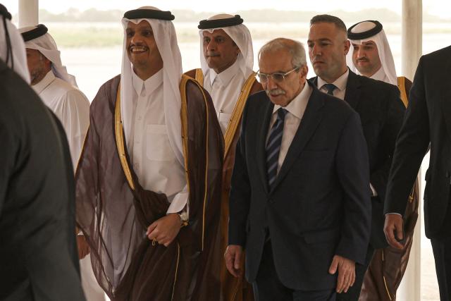Qatar's Prime Minister and Foreign Minister Sheikh Mohammed bin Abdulrahman bin Jassim Al-Thani (L) is received by Lebanese Prime Minister Nawaf Salam as he arrives at Beirut-Rafic Hariri International Airport during an official visit to Lebanon on October 15, 2026. (Photo by Anwar AMRO / AFP)