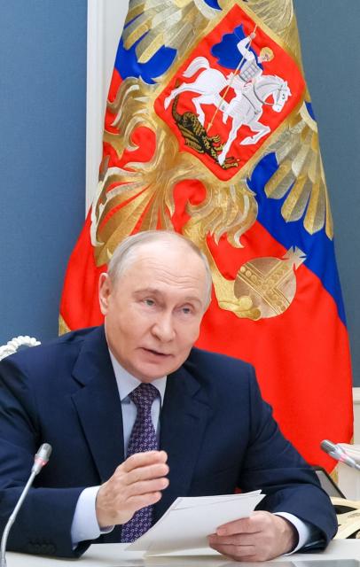 In this pool photograph distributed by the Russian state agency Sputnik, Russia's President Vladimir Putin attends a forum of the all-Russian public organization "Delovaya Rossiya", a union of entrepreneurs, via videocall in Moscow on October 15, 2026. (Photo by Mikhail METZEL / POOL / AFP)