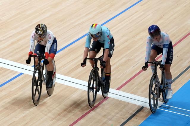 Japan's Yumi Kajihara (L), Belgium's Lotte Kopecky (C) and USA's Megan Jastrab react after the women's elimination race at the 2026 UCI Track World Championships at the Shanghai Velodrome in Shanghai on October 15, 2026. (Photo by CN-STR / AFP) / China OUT