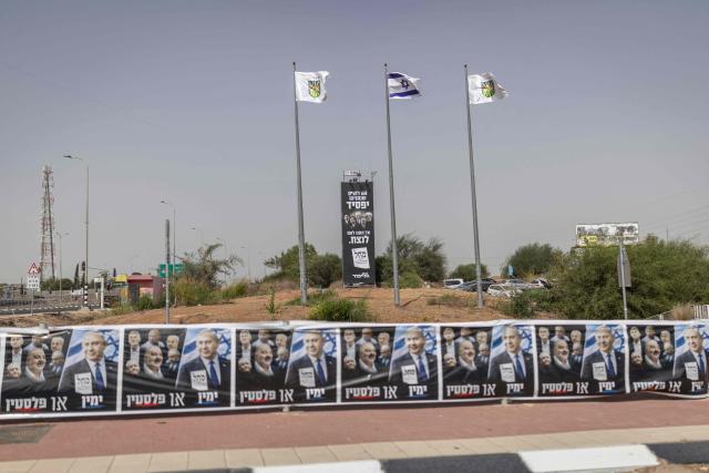 Posters in support of Prime Minister Benjamin Netanyahu sit at the entrance to Sderot on October 15, 2026. Israel heads to the polls on October 27 in its first election since the October 7, 2023 Hamas-led attack, in what is seen as a referendum on the prime minister. (Photo by Ilia YEFIMOVICH / AFP)
