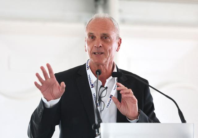 Founder, President and CEO of French logistics company Modal Group, Bernard Mei, gestures as he talks during the inauguration of the Port of Dunkirk’s new intermodal rail terminal in Loon-Plage near Dunkirk on October 15, 2026. (Photo by Francois LO PRESTI / AFP)