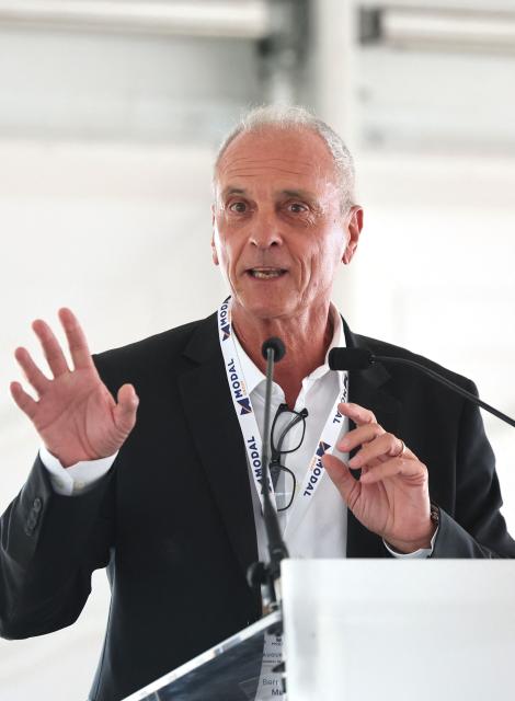 Founder, President and CEO of French logistics company Modal Group, Bernard Mei, gestures as he talks during the inauguration of the Port of Dunkirk’s new intermodal rail terminal in Loon-Plage near Dunkirk on October 15, 2026. (Photo by Francois LO PRESTI / AFP)