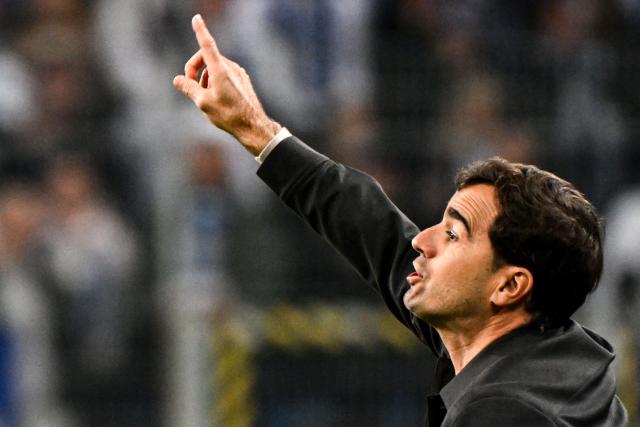 Bayer Leverkusen's Spanish coach Carles Martinez reacts during the UEFA Europa League football match between Lech Poznan and Bayer Leverkusen in Poznan, on October 15, 2026. (Photo by Sergei GAPON / AFP)