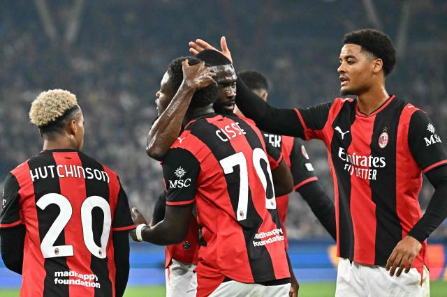 AC Milan's Italian midfielder #70 Alphadjo Cisse (C) celebrates with teammates scoring the opening goal during the UEFA Europa League football match between Salzburg and AC Milan in Salzburg, on October 15, 2026. (Photo by Joe Klamar / AFP)