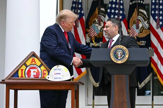US President Donald Trump shakes hands with President of the National Border Patrol Council Paul Perez in the Rose Garden at the White House, Washington DC, October 15, 2026. (Photo by Jim WATSON / AFP)