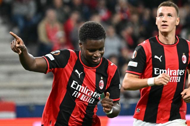 AC Milan's Italian midfielder #70 Alphadjo Cisse celebrates scoring his team's second goal during the UEFA Europa League football match between Salzburg and AC Milan in Salzburg, on October 15, 2026. (Photo by Joe Klamar / AFP)
