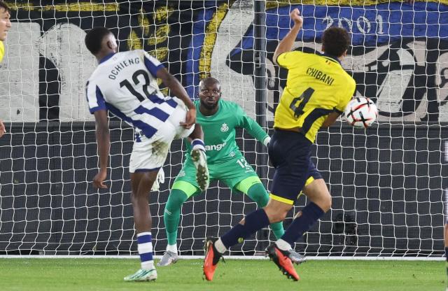 Real Sociedad's forward #12 Job Ochieng (L) vies with Union Saint-Gilloise's defender #04 Nohim Chibani (R) in front of Union Saint-Gilloise's goalkeeper #12 Herve Koffi (C) during the UEFA Europa League, league phase matchday 2, football match between Union Saint-Gilloise and Real Sociedad at the Den Dreef stadium in Leuven, on October 15, 2026. (Photo by VIRGINIE LEFOUR / BELGA / AFP) / Belgium OUT