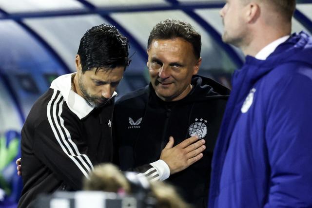 Anderlecht's Portuguese coach Vítor Bruno and Dinamo Zagreb's head coach Mario Kovacevic look on before the UEFA Europa League, league phase matchday 2, football match between Dinamo Zagreb and Anderlecht at the Stadion Maksimir in Zagreb, on October 15, 2026. (Photo by MARKO PERKOV / AFP)