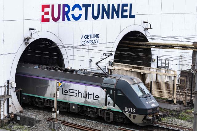 (FILES) A Eurotunnel shuttle with the logo of its new trademark "LeShuttle" enters the Channel Tunnel, operated by the company Eurotunnel, in Coquelles, northern France on April 2, 2026. A bus collided with a train near the Channel Tunnel late October 15, 2026, injuring 19 people including the bus driver and 18 passengers, the Pas-de-Calais prefecture announced. (Photo by Sameer Al-DOUMY / AFP)