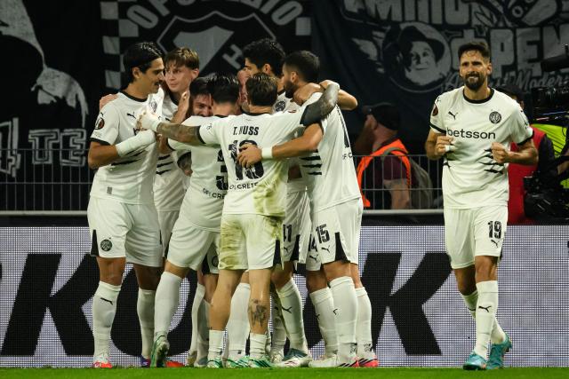 Ofi Crete players celebrate after scoring their first goal during the UEFA Europa League, league phase matchday 2, football match between Stade Rennais and OFI Crete at The Roazhon Stadium in Rennes, western France on October 15, 2026. (Photo by Loic VENANCE / AFP)