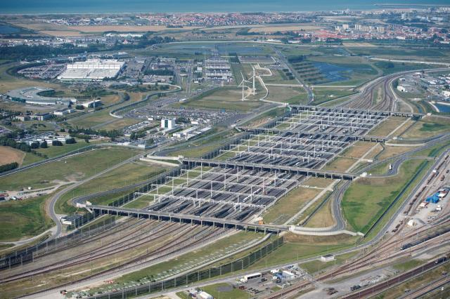 (FILES) This aerial view on August 16, 2016 shows an aerial view of the Eurotunnel at Coquelles, near Calais, northern France  on August 16, 2016. A bus collided with a train near the Channel Tunnel late October 15, 2026, injuring 19 people including the bus driver and 18 passengers, the Pas-de-Calais prefecture announced. (Photo by PHILIPPE HUGUEN / AFP)