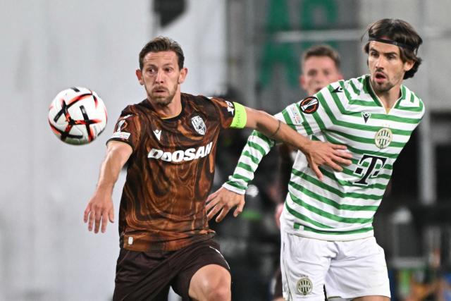 Viktoria Plzen's Slovak midfielder #17 Patrik Hrosovsky (L) and Ferencvaros' Hungarian midfielder #06 Adam Nagy vie for the ball during the UEFA Europa League football match between Ferencvaros and Viktoria Plzen in Budapest, on October 15, 2026. (Photo by Attila KISBENEDEK / AFP)