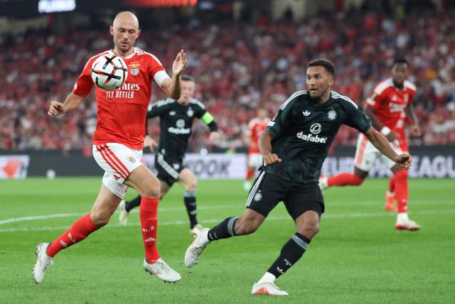 Benfica's Norwegian midfielder #08 Fredrik Aursnes and Celtic's US defender #06 Auston Trusty fight for the ball during the Europa League round 1 day 2 football match between SL Benfica and Celtic FC at the Luz Stadium in Lisbon on October 15, 2026. (Photo by PATRICIA DE MELO MOREIRA / AFP)