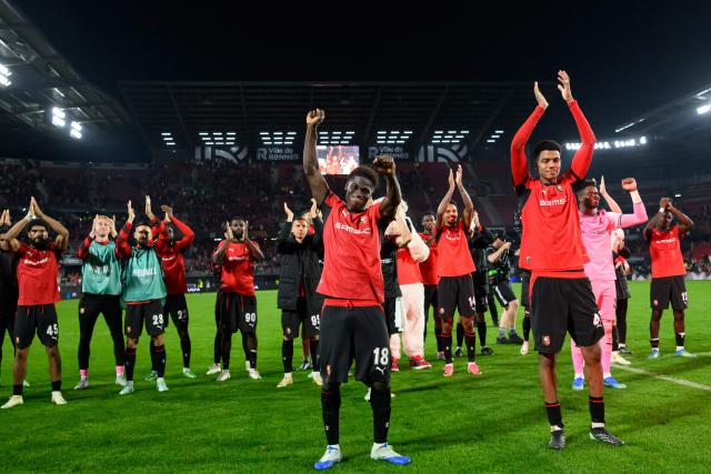 Rennes' players including Rennes' defender #18 Mahamadou Nagida (C) celebrate in front of supporters after victory in the UEFA Europa League, league phase matchday 2, football match between Stade Rennais and OFI Crete at the Roazhon Park in Rennes, western France on October 15, 2026. (Photo by Loic VENANCE / AFP)