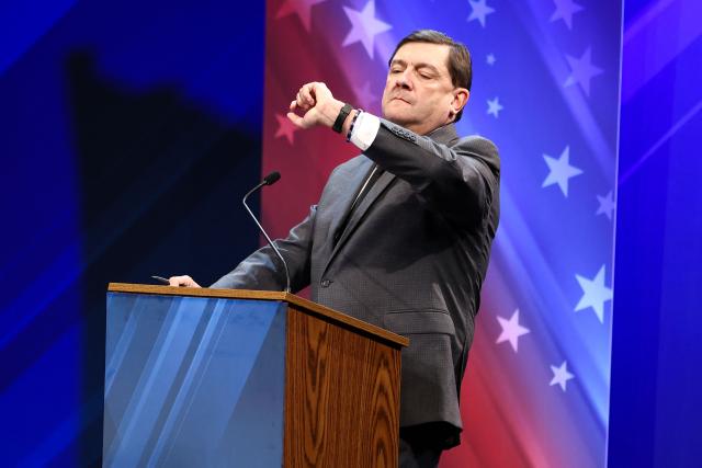 Democratic candidate for US Senate Troy Jackson checks his watch during a debate with US Senator Susan Collins (R-ME) at the Gracie Theatre in Bangor, Maine on October 15, 2026. Jackson is looking to unseat the five-term senator in November's midterm election. Americans voting in the November 3 midterm elections will decide who controls Congress for the final two years of Donald Trump's presidency, along with dozens of governorships and thousands of state offices. (Photo by CHARLY TRIBALLEAU / AFP)