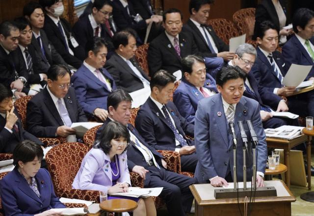 Japan’s new Minister of Agriculture, Forestry and Fisheries Arata Takebe (R) speaks during a House of Councillors budget committee meeting in the National Diet Building in Tokyo on October 16, 2026. (Photo by JIJI PRESS / AFP) / Japan OUT