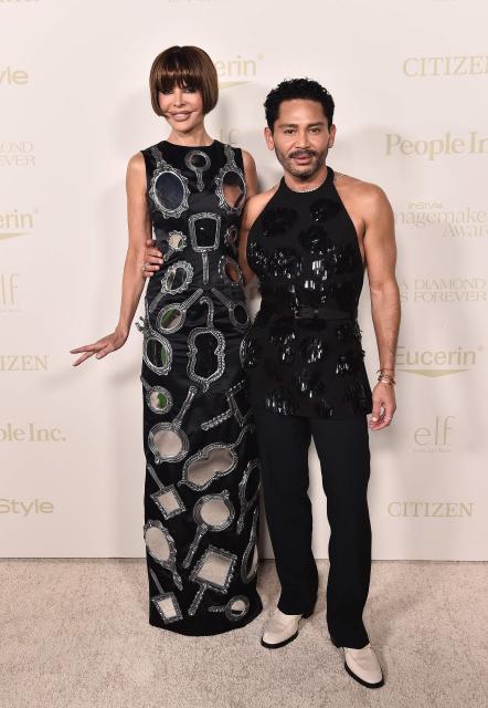 US TV personality Lisa Rinna and US celebrity trainer Isaac Boots attend the 3rd Annual InStyle Imagemaker Awards in Los Angeles on October 15, 2026. (Photo by LISA O'CONNOR / AFP)