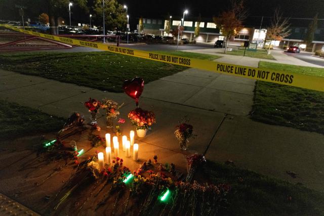Candles and flowers are seen at a makeshift memorial outside the Silver Rail Elementary School following a shooting in Bend, Oregon, on October 15, 2026. Three children and one teacher were shot dead at an elementary school Thursday in the northwestern US state of Oregon, police said, adding that the assailant was a 16-year-old who was killed by an armed bystander. (Photo by Payton Bruni / AFP)