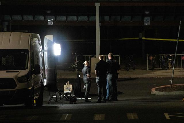 Police investigators work the scene at Silver Rail Elementary School following a shooting in Bend, Oregon, on October 15, 2026. Three children and one teacher were shot dead at an elementary school Thursday in the northwestern US state of Oregon, police said, adding that the assailant was a 16-year-old who was killed by an armed bystander. (Photo by Payton Bruni / AFP)