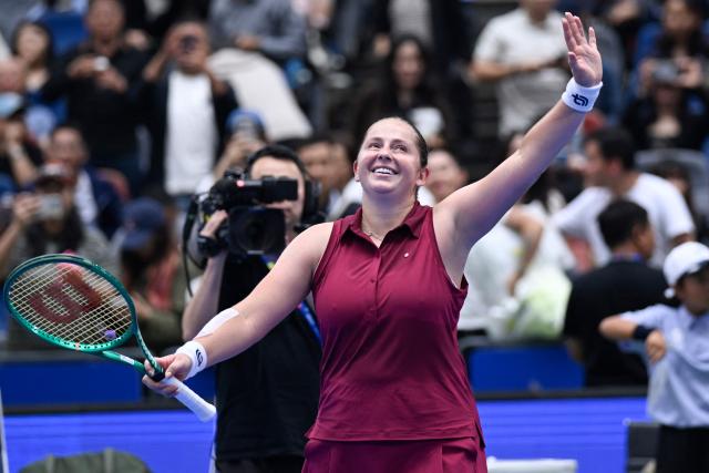 Latvia's Jelena Ostapenko celebrates after beating Russia's Diana Shnaider in their women's singles quarter final match at the Wuhan Open tennis tournament in Wuhan, China's Hubei province on October 16, 2026. (Photo by WANG Zhao / AFP)