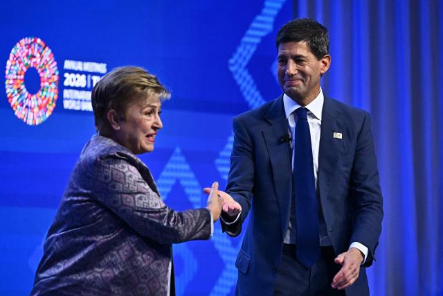 Chairman of the US Federal Reserve Kevin Warsh (R) stands with IMF Managing Director Kristalina Georgieva (L) during a "fireside chat" at the Annual Meetings of the International Monetary Fund (IMF) and the World Bank Group (WBG) at the Queen Sirikit National Convention Center (QSNCC) in Bangkok on October 16, 2026. (Photo by Lillian SUWANRUMPHA / AFP)