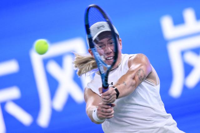 Britain's Sonay Kartal hits a return to Ukraine’s Elina Svitolina during the women’s singles quarter final match at the Wuhan Open tennis tournament in Wuhan, China's Hubei province on October 16, 2026. (Photo by WANG Zhao / AFP)