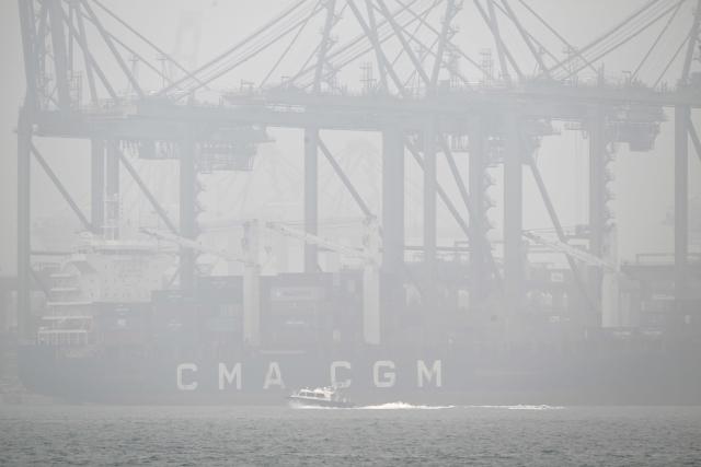 Pasir Panjang port terminal is shrouded with thick haze in Singapore on October 16, 2026. Toxic haze has covered parts of Indonesia, Malaysia and Singapore for weeks as Jakarta struggles to contain fires that have scorched large tracts of Borneo and Sumatra, with the smoke drifting across the region. (Photo by Roslan RAHMAN / AFP)