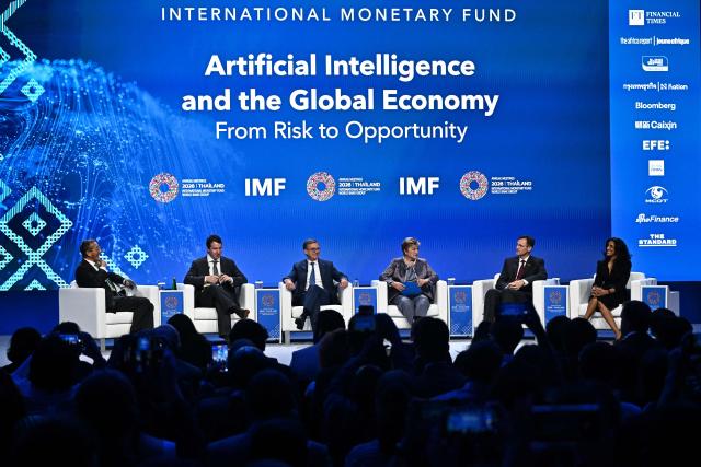 (L-R) CNN presenter Richard Quest, Co-founder and Head of Public Benefit of Anthropic Jack Clark, Bank of Canada Governor Tiff Macklem, IMF Managing Director Kristalina Georgieva, DHL Group CEO Tobias Meyer and CEO of Addo AI Ayesha Khanna converse during the AI and the Global Economy: From Risk to Opportunity panel at the Annual Meetings of the International Monetary Fund (IMF) and the World Bank Group (WBG) at the Queen Sirikit National Convention Center (QSNCC) in Bangkok on October 16, 2026. (Photo by Lillian SUWANRUMPHA / AFP)