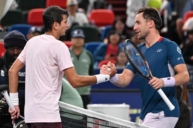 Spain's Rafael Jodar (L) shakes hands with Norway's Casper Ruud after his victory during their men's singles quarter-final match at the Shanghai Masters tennis tournament in Shanghai on October 16, 2026. (Photo by Hector RETAMAL / AFP)