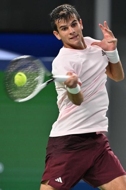 Spain's Rafael Jodar hits a return to Norway's Casper Ruud during their men's singles quarter-final match at the Shanghai Masters tennis tournament in Shanghai on October 16, 2026. (Photo by Hector RETAMAL / AFP)
