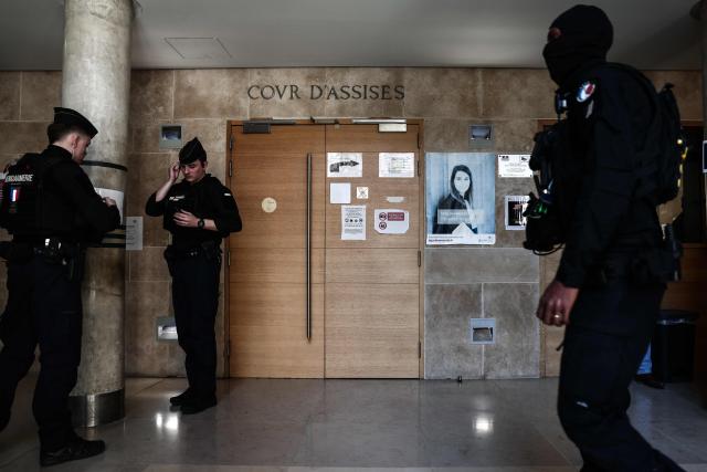 (FILES) Members of the Regional Intervention and Security Teams (ERIS) stand guard inside the courthouse on the opening day of the trial of alleged members of the DZ Mafia drug trafficking organisation over a double murder committed in 2019, in Aix-en-Provence, southern France on March 23, 2026. In Marseille, gunfire has become less frequent: there have been five drug-related killings since January, 2026. This lull is attributed both to the ‘hegemony’ of the DZ Mafia and to the police and judicial crackdown on several of its key figures, who are now behind bars. (Photo by Thibaud MORITZ / AFP)