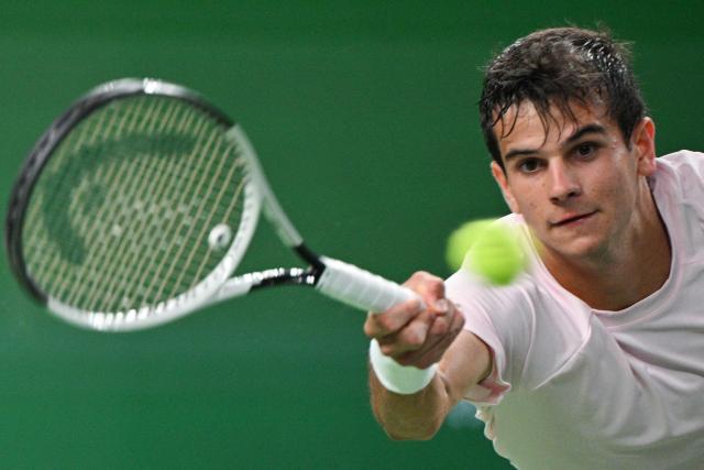 Spain's Rafael Jodar hits a return to Norway's Casper Ruud during their men's singles quarter-final match at the Shanghai Masters tennis tournament in Shanghai on October 16, 2026. (Photo by Hector RETAMAL / AFP)