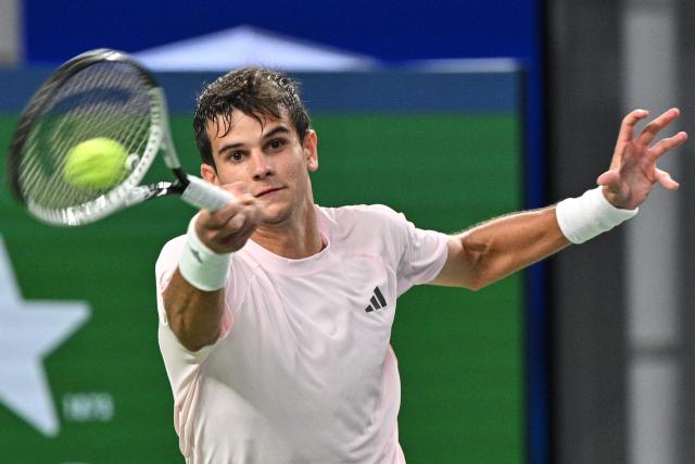 Spain's Rafael Jodar hits a return to Norway's Casper Ruud during their men's singles quarter-final match at the Shanghai Masters tennis tournament in Shanghai on October 16, 2026. (Photo by Hector RETAMAL / AFP)