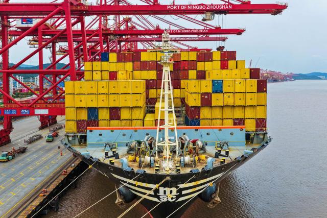 Containers are seen on a MSC ship at the Ningbo-Zhoushan port in Ningbo, in China's eastern Zhejiang Province on October 15, 2026. (Photo by CN-STR / AFP) / China OUT