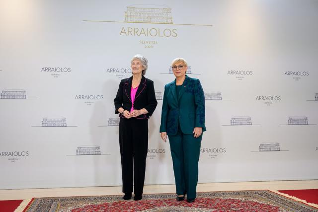 Ireland's president Catherine Connolly (L) is welcomed by Slovenia's President Natasa Pirc Musar (R) upon arrival at the 21st Arraiolos Meeting of non-executive EU heads of state in Brdo pri Kranju on October 16, 2026. (Photo by Jure Makovec / AFP)