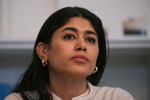 (FILES) French-Palestinian member of the European Parliament Rima Hassan looks on during a press conference with her lawyer following a hearing at the regional headquarters of the judiciary police in Paris, France, on April 3, 2026. The trial of La France Insoumise (LFI) MEP Rima Hassan on charges of alleged justification of terrorism will take place in Paris from October 19 to 20, 2026. (Photo by Blanca CRUZ / AFP)