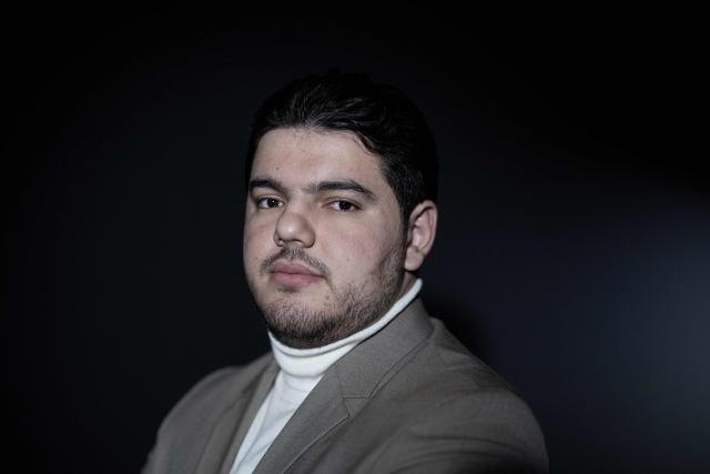 (FILES) French anti-drug activist Amine Kessaci poses during a photo session in Paris, on December 26, 2025. The trial of the alleged killers of the older brother of anti-drug trafficking activist Amine Kessaci and of two other young men, killed in December 2020, will take place in Aix-en-Provence from October 19 to November 6, 2026. (Photo by ALAIN JOCARD / AFP)