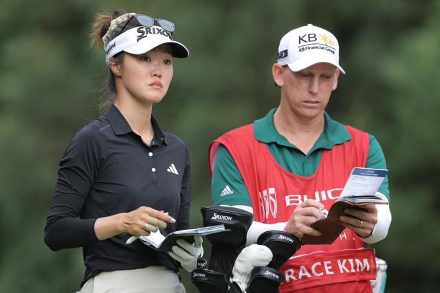 Australia's Grace Kim stands with her caddie during the Buick LPGA Shanghai golf tournament in Shanghai on October 16, 2026. (Photo by CN-STR / AFP) / China OUT