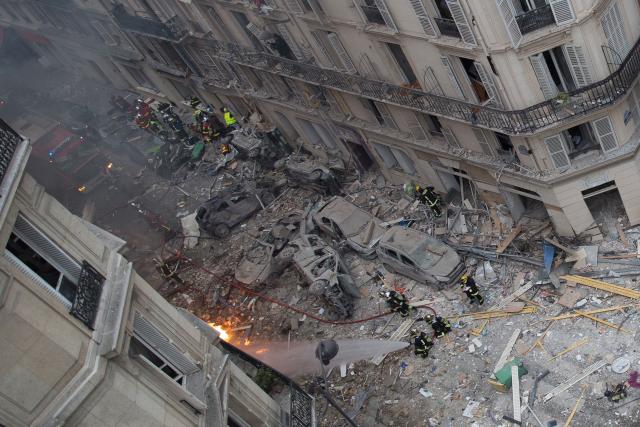 (FILES) A general view shows debris and car wreckage following the explosion of a bakery on the corner of the streets Saint-Cecile and Rue de Trevise in central Paris on January 12, 2019. Nearly eight years after the explosion on Rue de Trevise in Paris, which killed four people and injured more than 60, the City of Paris and the property manager of the building in question are facing charges of involuntary manslaughter and injury before the Paris Criminal Court in a trial expected to last from October 20 to December 7, 2026. (Photo by Carl LABROSSE / AFP)