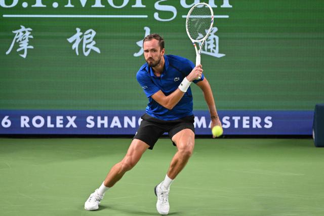 Russia's Daniil Medvedev hits a return to USA's Tommy Paul during their men's singles quarter-final match at the Shanghai Masters tennis tournament in Shanghai on October 16, 2026. (Photo by Hector RETAMAL / AFP)
