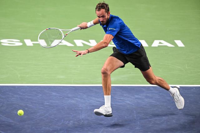 Russia's Daniil Medvedev hits a return to USA's Tommy Paul during their men's singles quarter-final match at the Shanghai Masters tennis tournament in Shanghai on October 16, 2026. (Photo by Hector RETAMAL / AFP)