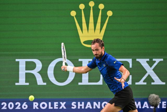 Russia's Daniil Medvedev hits a return to USA's Tommy Paul during their men's singles quarter-final match at the Shanghai Masters tennis tournament in Shanghai on October 16, 2026. (Photo by Hector RETAMAL / AFP)