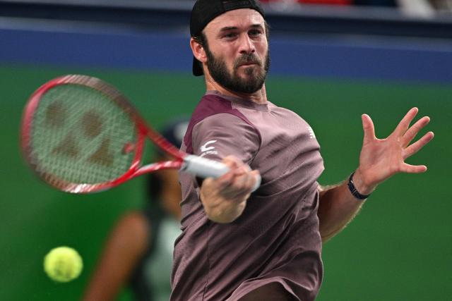 USA's Tommy Paul hits a return to Russia's Daniil Medvedev during their men's singles quarter-final match at the Shanghai Masters tennis tournament in Shanghai on October 16, 2026. (Photo by Hector RETAMAL / AFP)