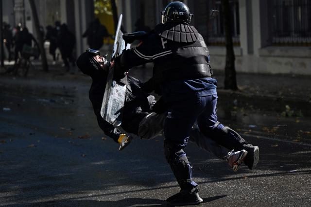 An anti-riot police officer pushes a protester with his protective shield during an anti-government demonstration in central Tirana on October 16, 2026, as protests continued for a fourth consecutive day over university conditions and demands for the resignation of Albanian Prime Minister Edi Rama. For more than four months, anti-government protests in Albanian have routinely drawn crowds in their thousands. They were originally sparked by a luxury hotel project linked to US President Donald Trump's family, which scientists said in July 2026 had already caused irreparable damage to a once pristine stretch of Albania's coast. (Photo by Armend NIMANI / AFP)