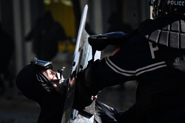 An anti-riot police officer pushes a protester with his protective shield during an anti-government demonstration in central Tirana on October 16, 2026, as protests continued for a fourth consecutive day over university conditions and demands for the resignation of Albanian Prime Minister Edi Rama. For more than four months, anti-government protests in Albanian have routinely drawn crowds in their thousands. They were originally sparked by a luxury hotel project linked to US President Donald Trump's family, which scientists said in July 2026 had already caused irreparable damage to a once pristine stretch of Albania's coast. (Photo by Armend NIMANI / AFP)