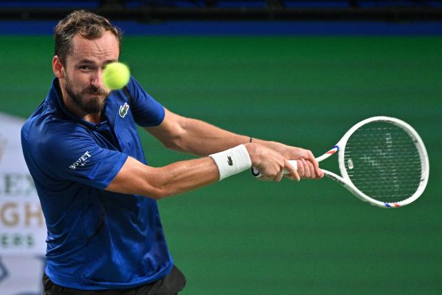 Russia's Daniil Medvedev hits a return to USA's Tommy Paul during their men's singles quarter-final match at the Shanghai Masters tennis tournament in Shanghai on October 16, 2026. (Photo by Hector RETAMAL / AFP)
